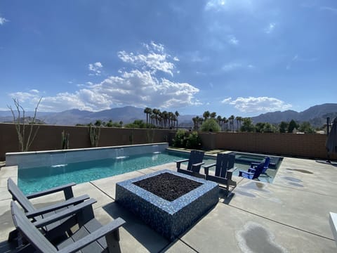 outdoor fire area next to pool w waterfalls view no neighbor to the right 