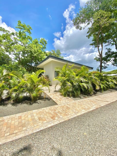 Lobos Two Casita surrounded by greenery. Image taken from driveway.