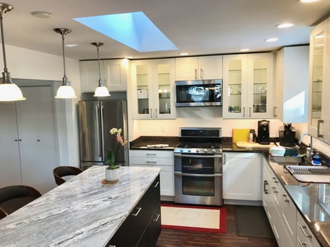 This chef's kitchen was recently remodeled and has modern equipment and supplies