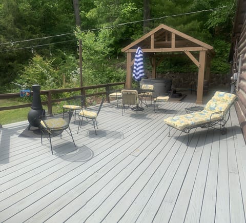 Large deck for al fresco dining, covered hot tub pavilion.