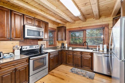 Spacious Warm Kitchen with Stainless Appliances