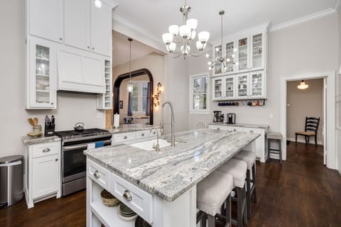 Large bright kitchen fully equipped for cooking and hosting. 