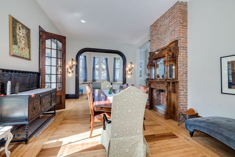 Large Dining room with ornate wood floors and fireplace, lots of seating options