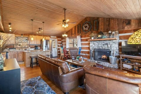 Large Living Room kitchen area with wood burning fireplace