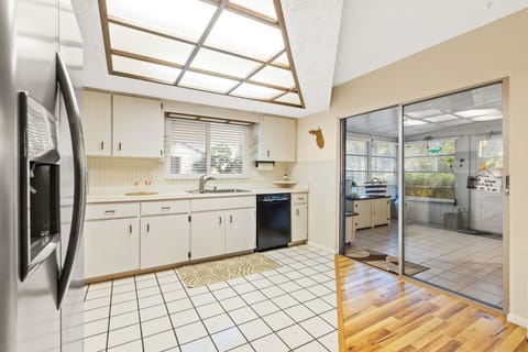 Full size kitchen with sliding door entry to bonus rec room