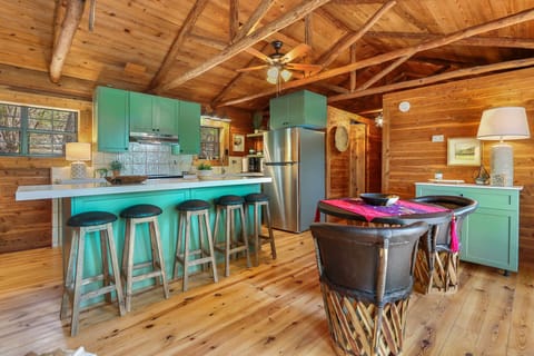 Bathroom entrance to right side of kitchen