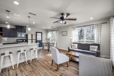 Bright open-concept space for cooking, dining, and relaxing.