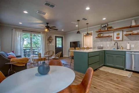 Bright, open living, dining, and kitchen area.