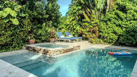 Pool and spa. Backyard is surrounded by tall plants and trees for full privacy