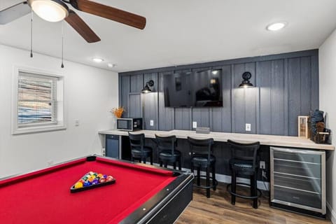 Catch a drink from wine + beverage refrigerators, bar stools to wait your turn