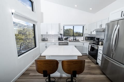 The kitchen island corner is the perfect place to entertain while you cook