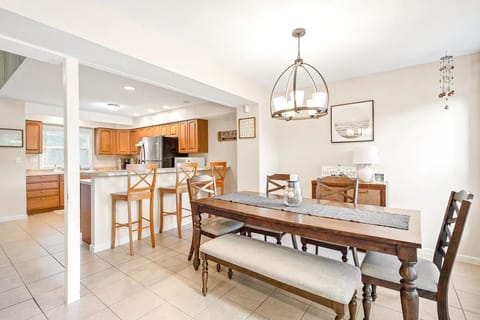 Nice dining table upstairs with 3 barstools for extra seating.