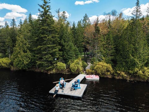 Settle into lake life. Verdant woods embrace your spirit.