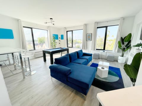 Modern, open-concept Livingroom area with lots of natural lighting. 