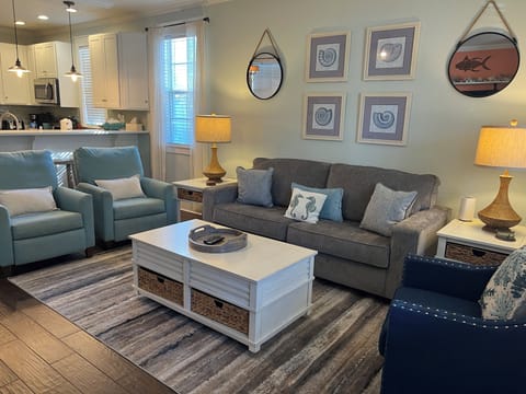 Living room with seating for 6 is open to the kitchen/dining 