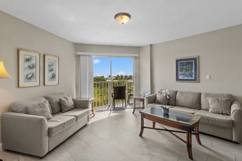 Stretch out on plush sofas in a sunlit, open lounge.