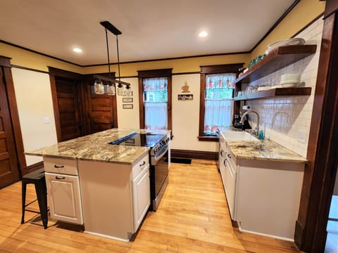 Kitchen features new appliances, granite counter tops and breakfast bar.