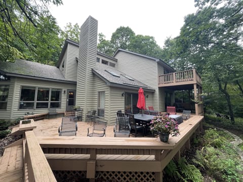 Multi-level deck, abundant seating, firepit, dining table, hot tub