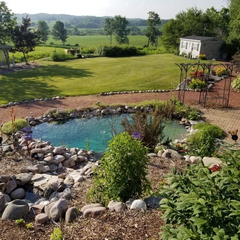 Sit by the pond on the bistro set while watching the sunrise.