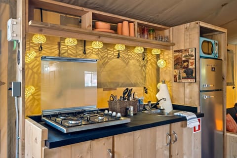 A small kitchenette providing you just enough to cook a home cooked meal.