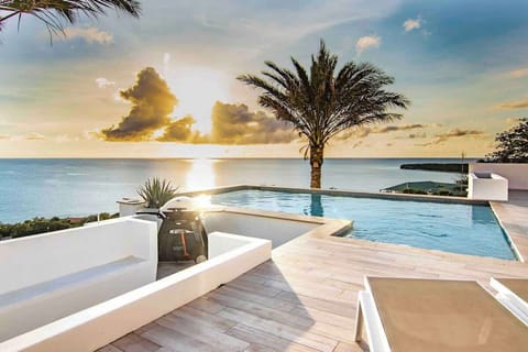 Enjoy breathtaking sunsets from the infinity pool — the perfect place to relax with a drink as the day winds down in paradise.