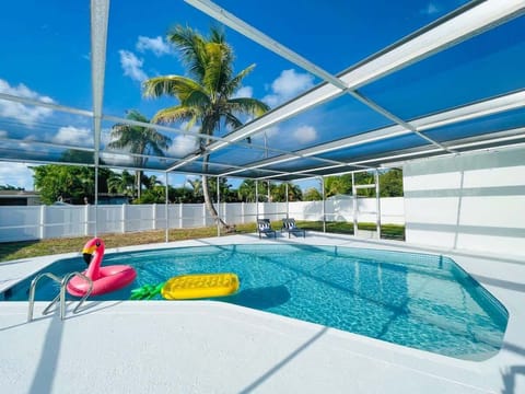 Outdoor PRIVATE HEATED POOL w. brand new diamond brite resurfaced and fun floaters - you are guaranteed to have a blast!  Fully screen enclosed patio. 2 sunbathing lounge chairs, 8-person all-white outdoor dining set, 4 bar stools, 2 widearm couches.