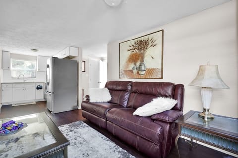 Living Room with 50" Smart HDTV and reclining sofa, which can sleep 1.