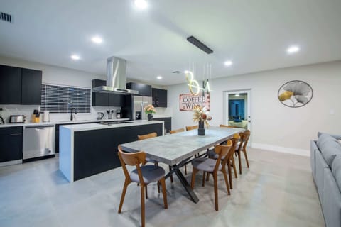 An open-concept space made for sharing! cook, dine, and connect in this modern kitchen and dining area.