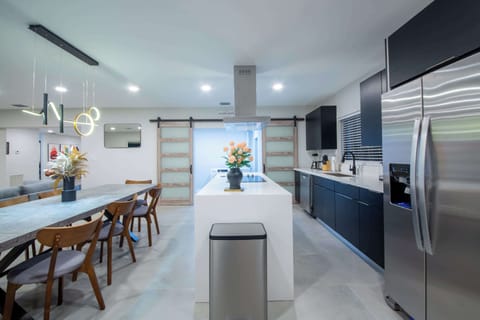 Fully equipped kitchen with sleek design and ample space, ideal for preparing meals and enjoying quality time together.