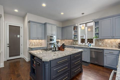 Huge kitchen with tons of light and commercial appliances