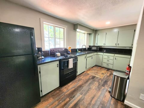 The kitchen is newly renovated with beautiful black granite countertops and a fresh coat of paint! We stock the kitchen with all of the dishes and cooking utensils you may need, as well as extra amenities such as coffee, sugar, coffee creamer, and paper towels.