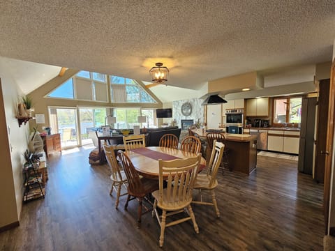 Open-concept kitchen, dining room and living room