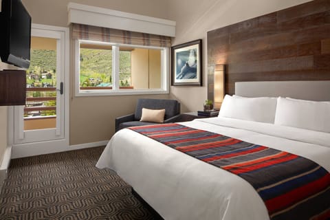 Master Bedroom offers a king-size bed, twin bed chair, balcony and a full bath.