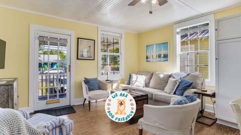 The bright and airy interior features a comfortable living room with a SmartTV, a fully-equipped kitchen, and a cozy dining area for enjoying meals together.