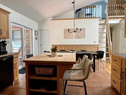 Open kitchen, dining, and living area with tons of natural light