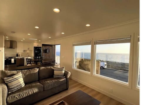 Living room and open kitchen with open ocean view