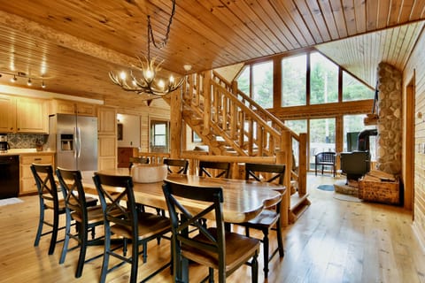 Our great room with our large dining table, stocked kitchen, & comfy living room