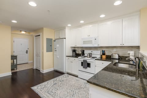 Kitchen, fully stocked with cooking/eating/drinking utensils