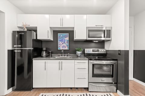 full kitchen with utensils, pots, pans, and basic cooking supplies 