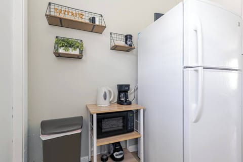 Coffee machine available in a compact kitchen area.