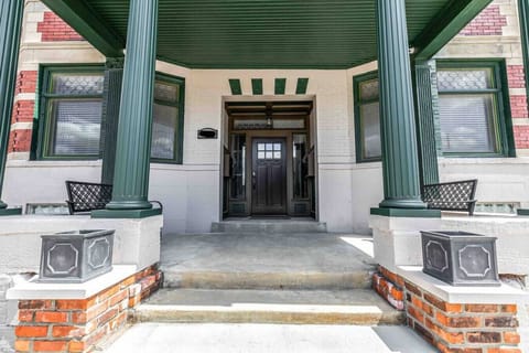 Front porch of building with benches for seating and smart lock access.