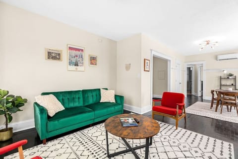 Fold down the green sofa to a twin futon. Extra blankets and pillows are provided.