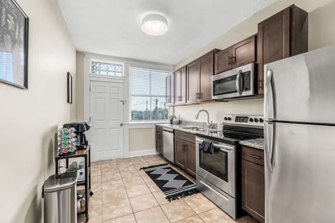 Prep a meal in the full size kitchen with stainless steel appliances including fridge, stove, microwave, and dishwasher. Coffee maker, tea kettle, cooking utensils, pots, pans, silverware and place settings provided. Not pictured is Brita water pitcher an