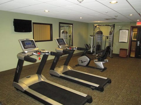 Fitness center with treadmills and exercise equipment.