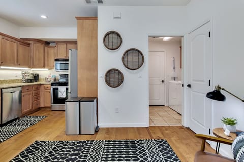 Overview of the kitchen and laundry area leading to the two car garage