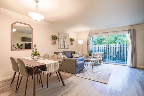 On the main floor of this 940 sq ft home, you'll find the open dining and living room space.