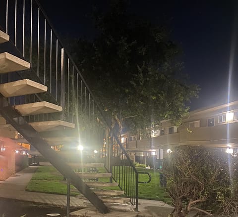 Night time Patio View. Well illuminated with a refined landscape. 