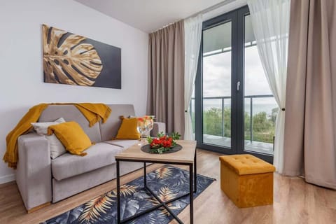 Living room with a comfortable sofa and TV. 
