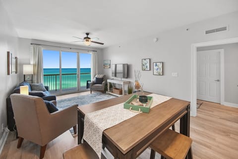 Wake to stunning turquoise waters through floor-to-ceiling windows in your bright, coastal-styled living space with ocean views.