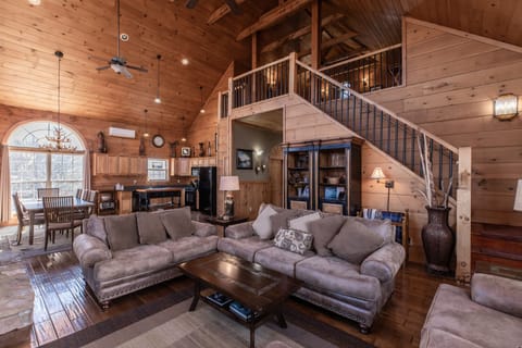 Main living room with stairs to loft